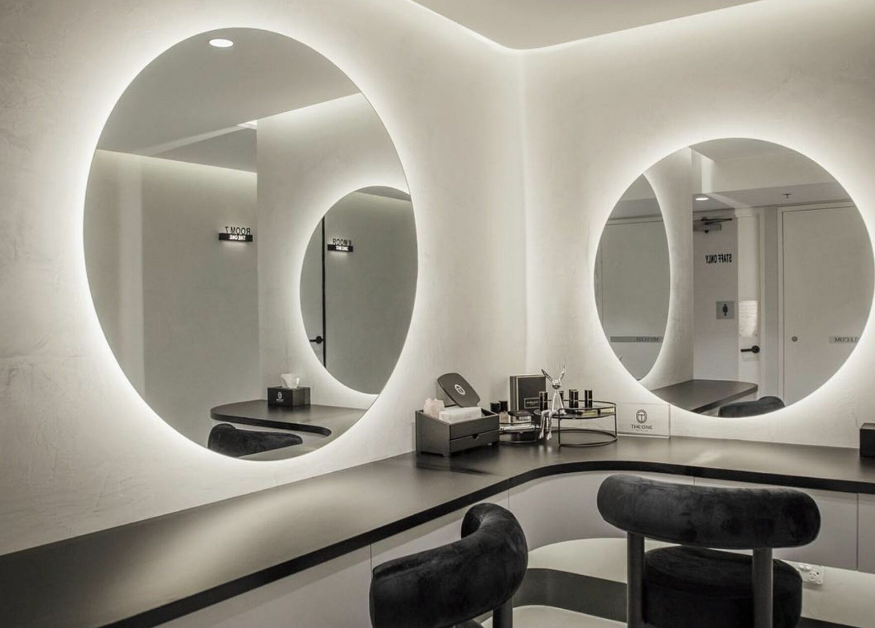 Modern beauty treatment room with circular mirrors at The One Skin Lab - QVB, Sydney, New South Wales, AU.