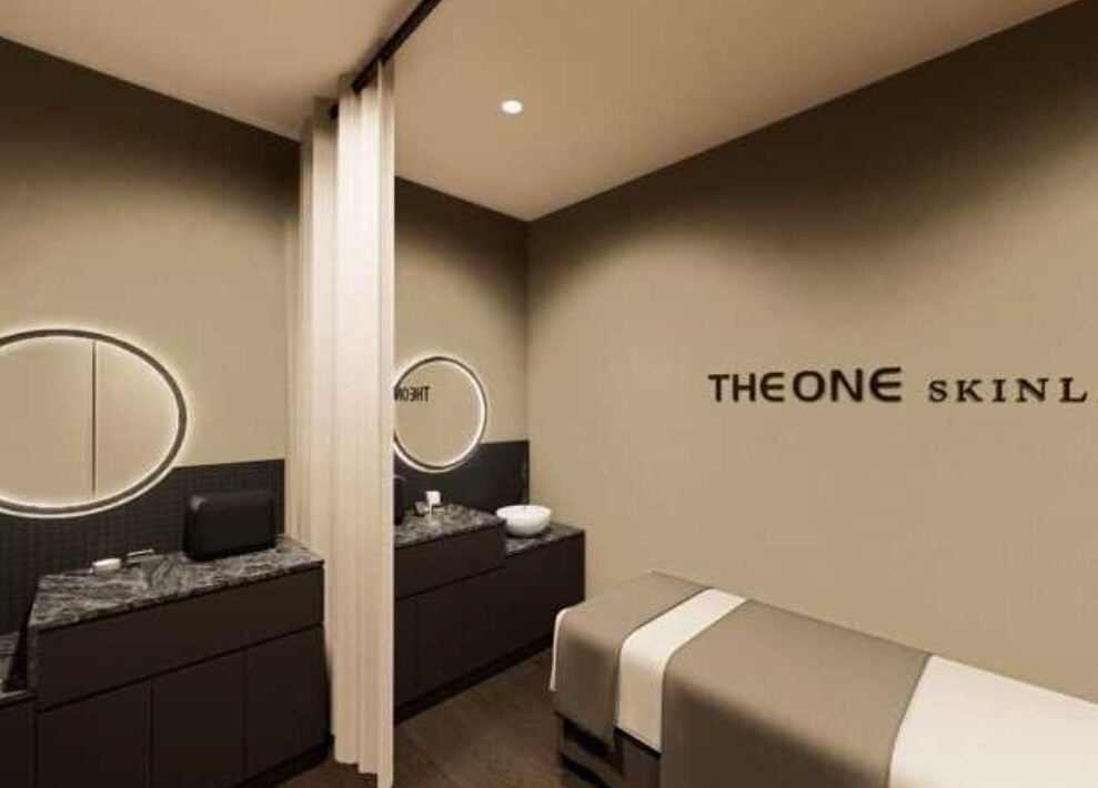 Elegant spa room at The One Skin Lab - Parramatta, New South Wales, AU with modern decor and soft lighting.