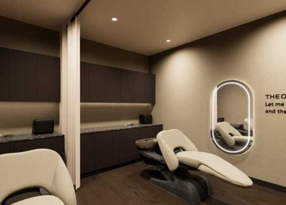 Relaxing treatment room at The One Skin Lab - Parramatta, New South Wales, AU with modern design and comfortable chair.