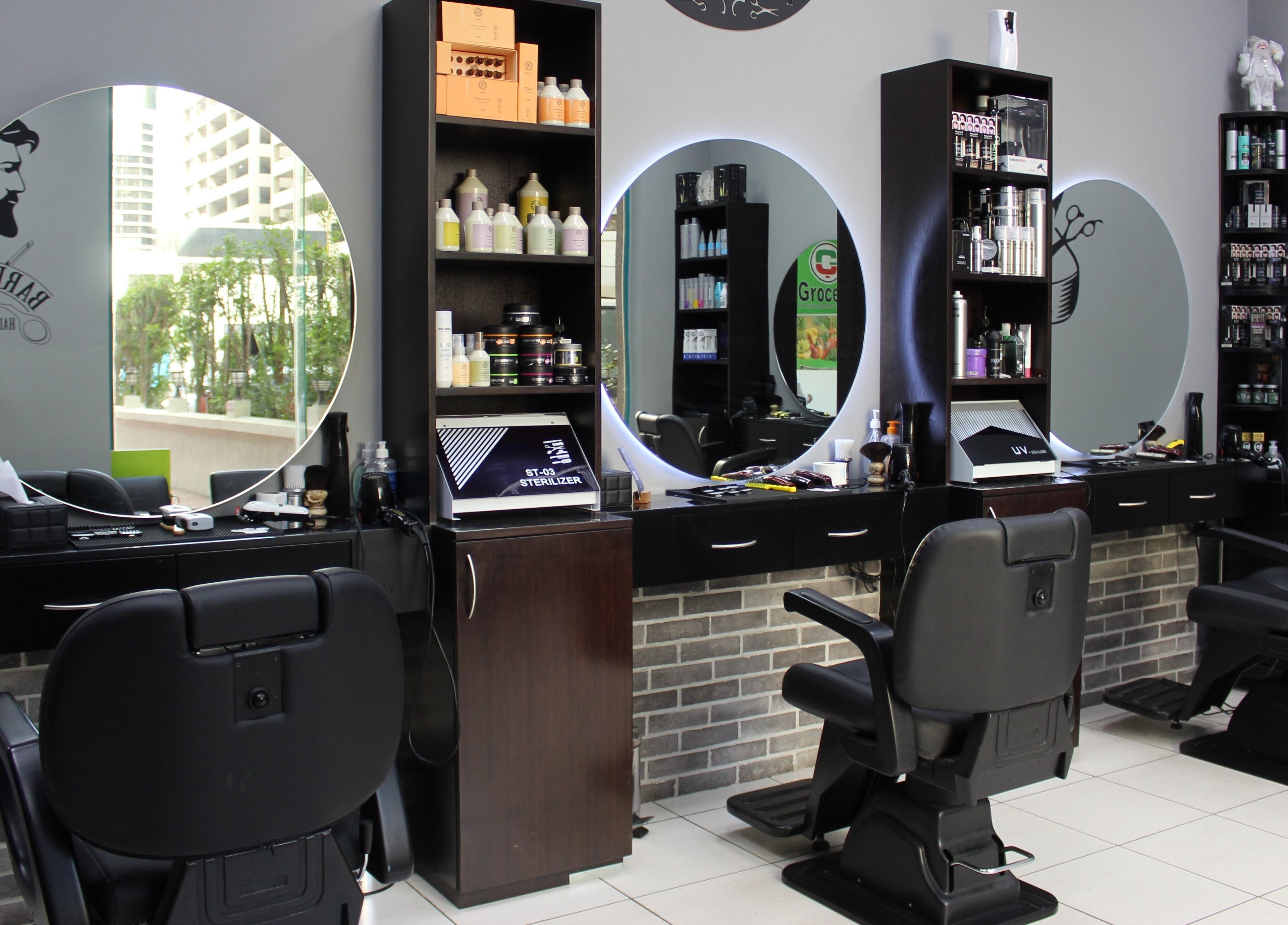 Modern salon interior with chairs and mirrors at White Tower Salon صالون البرج الأبيض - Sheikh Zayed Road, Dubai.
