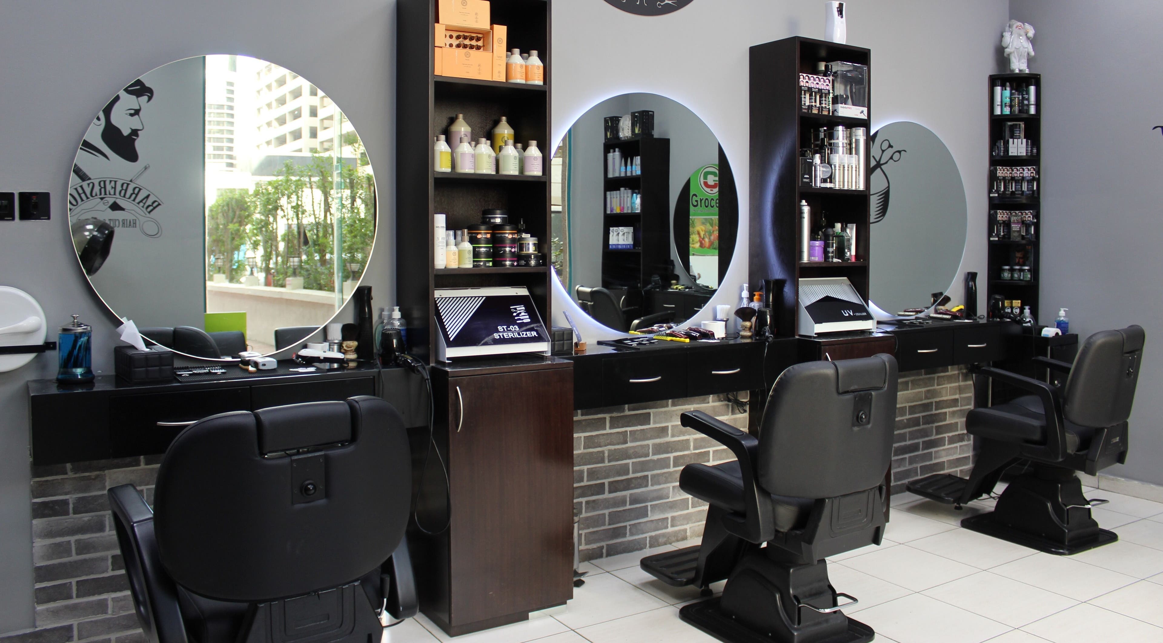 Modern salon interior with chairs and mirrors at White Tower Salon صالون البرج الأبيض - Sheikh Zayed Road, Dubai.