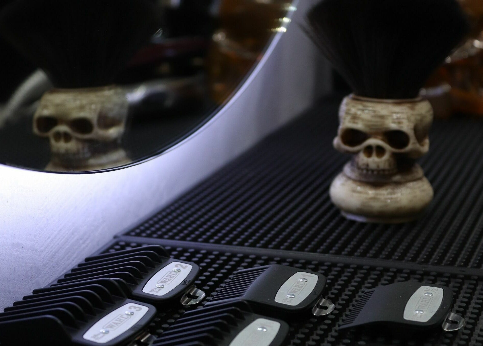 Skull sculpture with barber tools at White Tower Salon صالون البرج الأبيض - Digital Park, Dubai, AE.