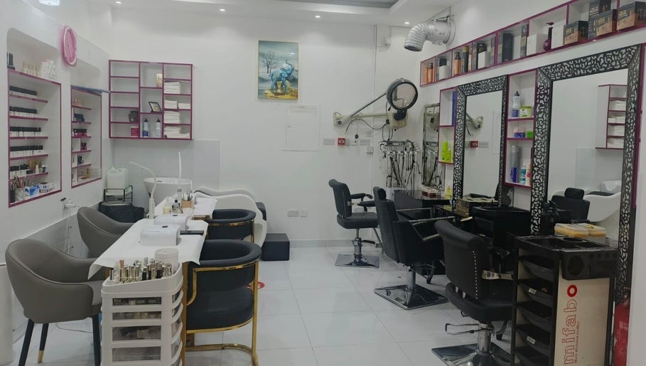 Bright, modern interior of Jamal Rosalina Ladies Salon in Dubai, Dubai, AE with styling chairs and product shelves.