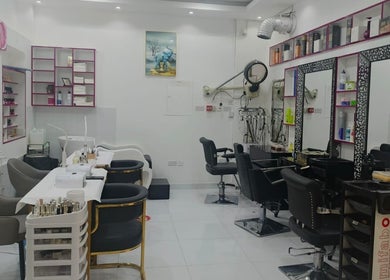 Bright, modern interior of Jamal Rosalina Ladies Salon in Dubai, Dubai, AE with styling chairs and product shelves.