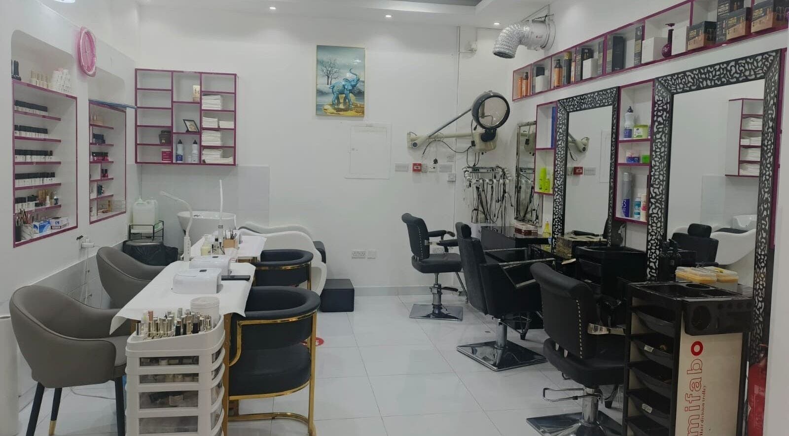 Bright, modern interior of Jamal Rosalina Ladies Salon in Dubai, Dubai, AE with styling chairs and product shelves.