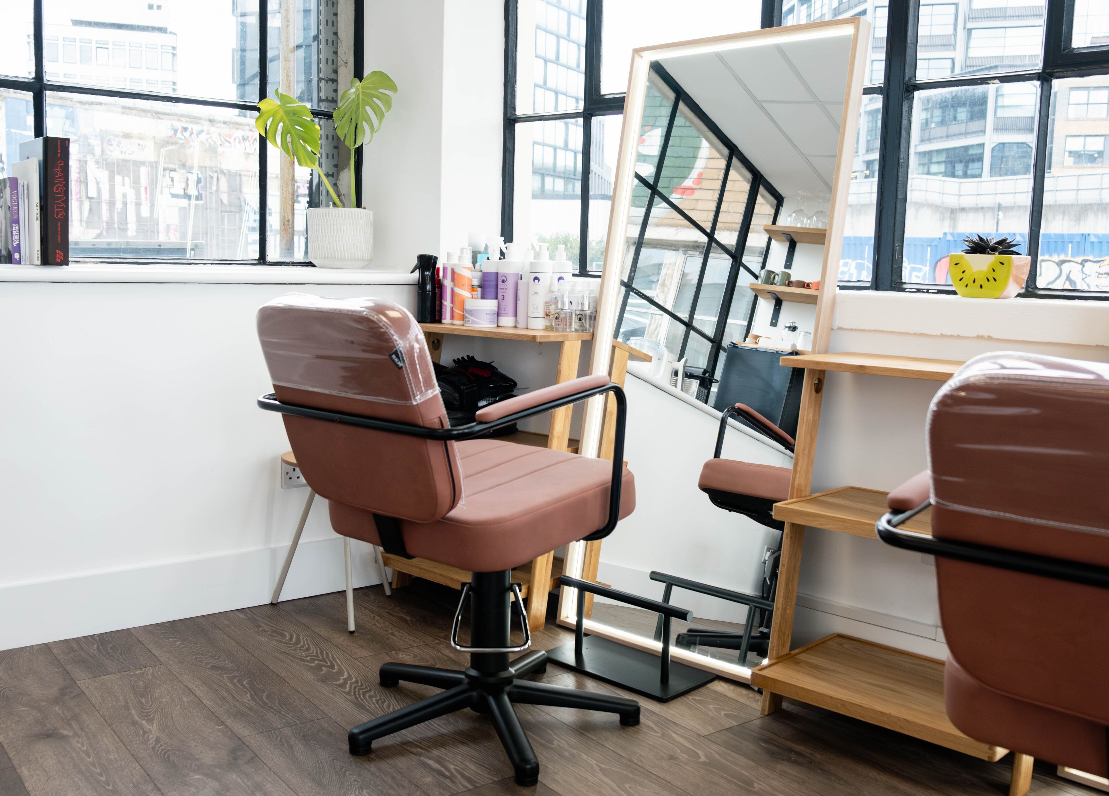 Modern salon chair and mirror at Albert Di Guida Hair London, London, England, GB.