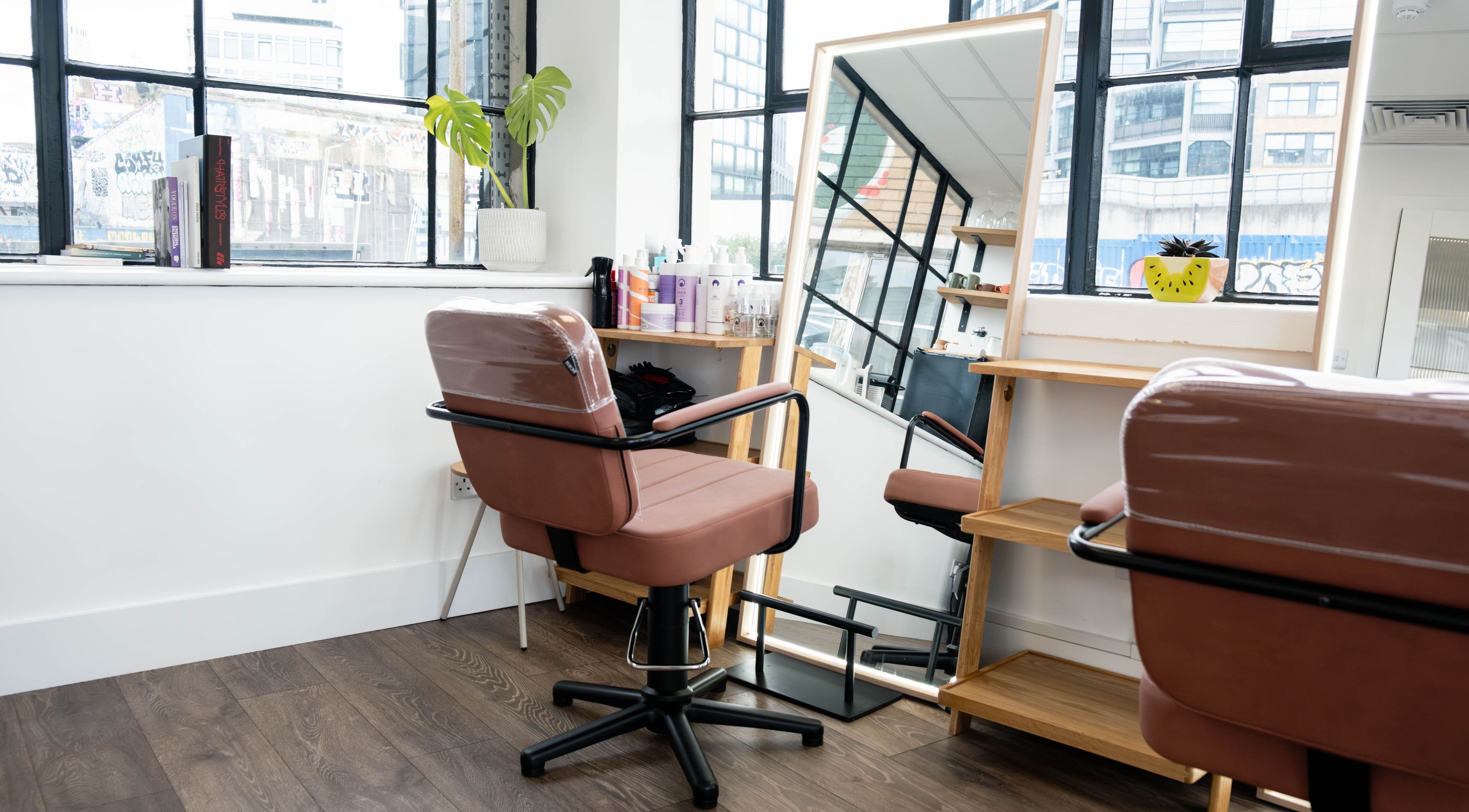 Modern salon chair and mirror at Albert Di Guida Hair London, London, England, GB.