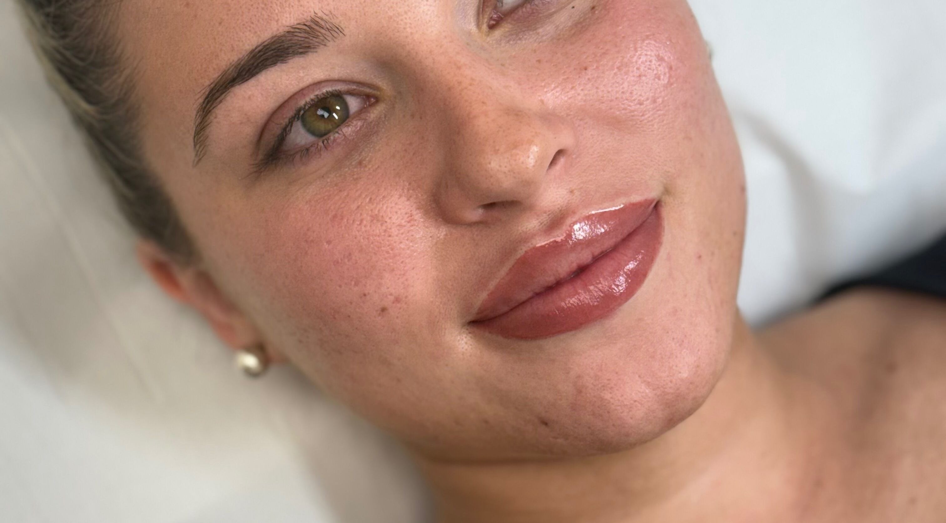 Close-up of a woman's glowing skin after beauty treatment at By Georgia, Horndon On The Hill, England, GB.