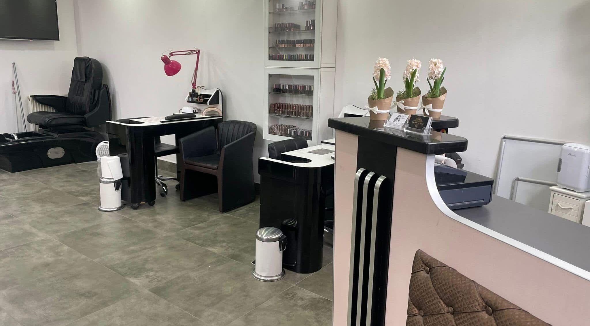 Interior of Droplet Of Style, a chic beauty salon in London, England, GB featuring elegant seating and modern decor.