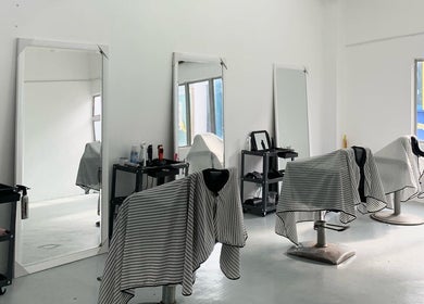 Interior of Valgos Barbershop in Rawang, Selangor, MY, showcasing sleek chairs and mirrors.