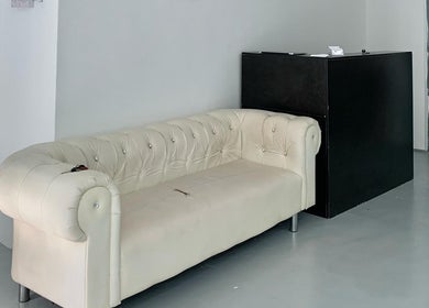 Elegant white sofa in the reception area of Valgos Barbershop, Rawang, Selangor, MY.
