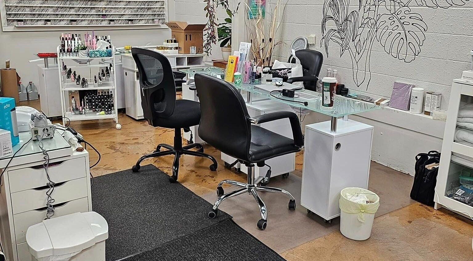 Modern nail station at Canopy Salon and Spa, Innisfail, Alberta, CA. Sleek chairs and organized tools.