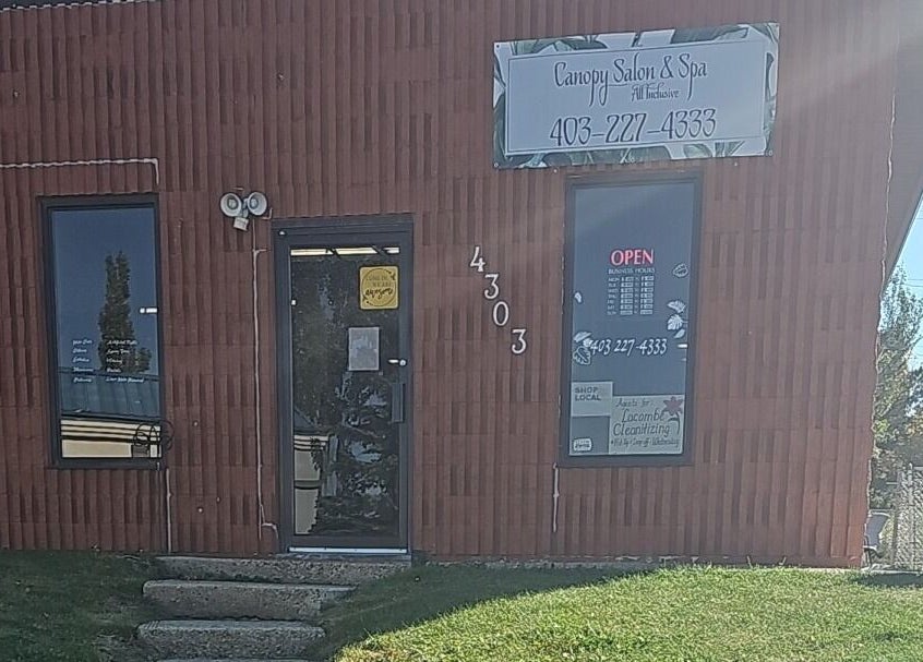Front entrance of Canopy Salon and Spa in Innisfail, Alberta, CA showcasing a welcoming facade.