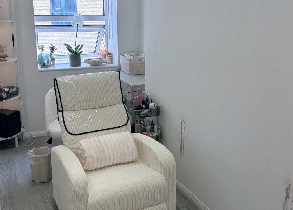 Relaxing room at Contoured by Isabel in Hull, England, GB with a plush chair and elegant decor.