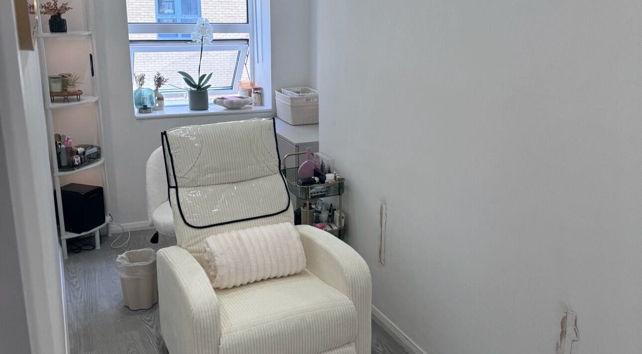 Relaxing room at Contoured by Isabel in Hull, England, GB with a plush chair and elegant decor.