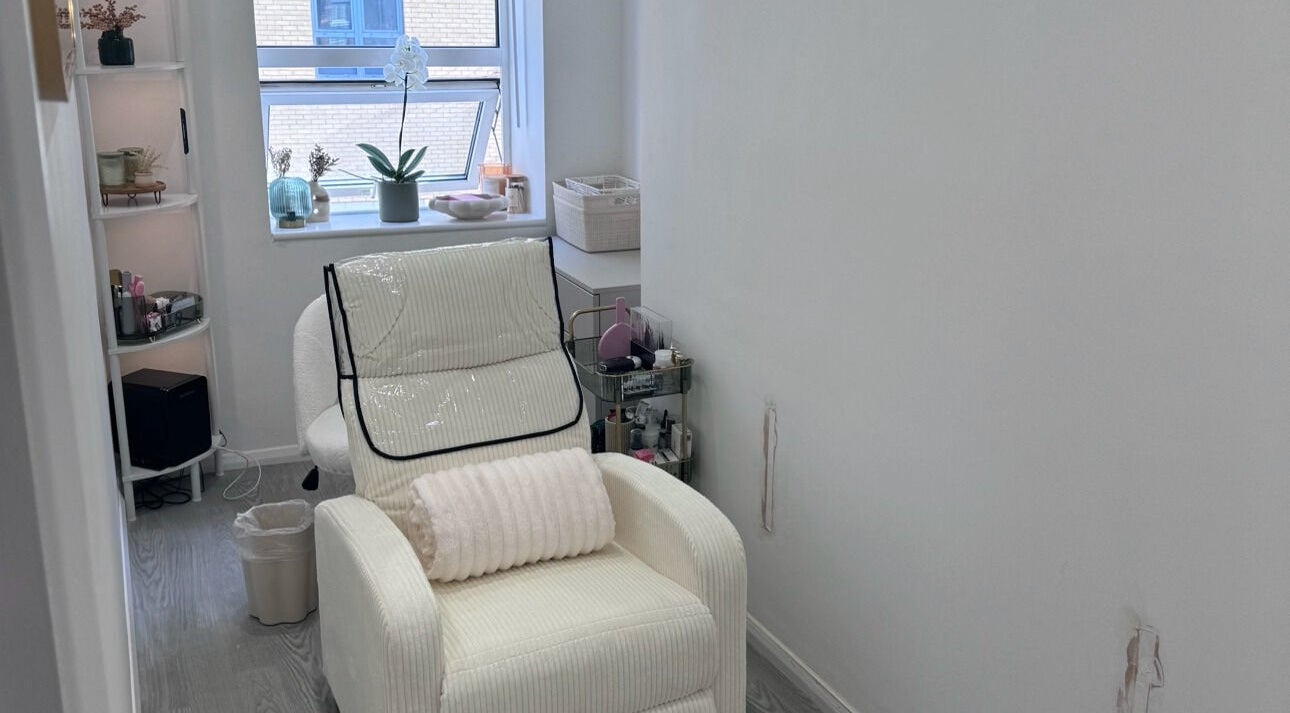 Relaxing room at Contoured by Isabel in Hull, England, GB with a plush chair and elegant decor.