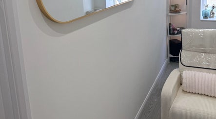 Sleek interior with a plush chair at Contoured by Isabel in Hull, England, GB, exudes a relaxing ambiance.