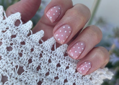 Close-up of polka dot nail art by Amy Howes Beauty in Staines-upon-Thames, England, GB, showcasing intricate patterns.