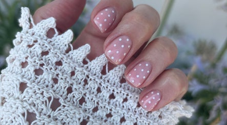 Close-up of polka dot nail art by Amy Howes Beauty in Staines-upon-Thames, England, GB, showcasing intricate patterns.