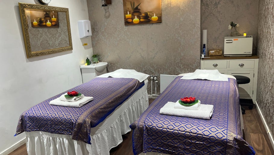 Inviting massage room at Kobkun Thai Spa in London, England, GB, with two adorned massage tables.