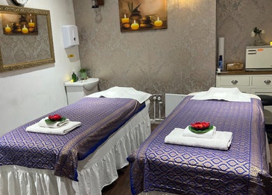 Inviting massage room at Kobkun Thai Spa in London, England, GB, with two adorned massage tables.