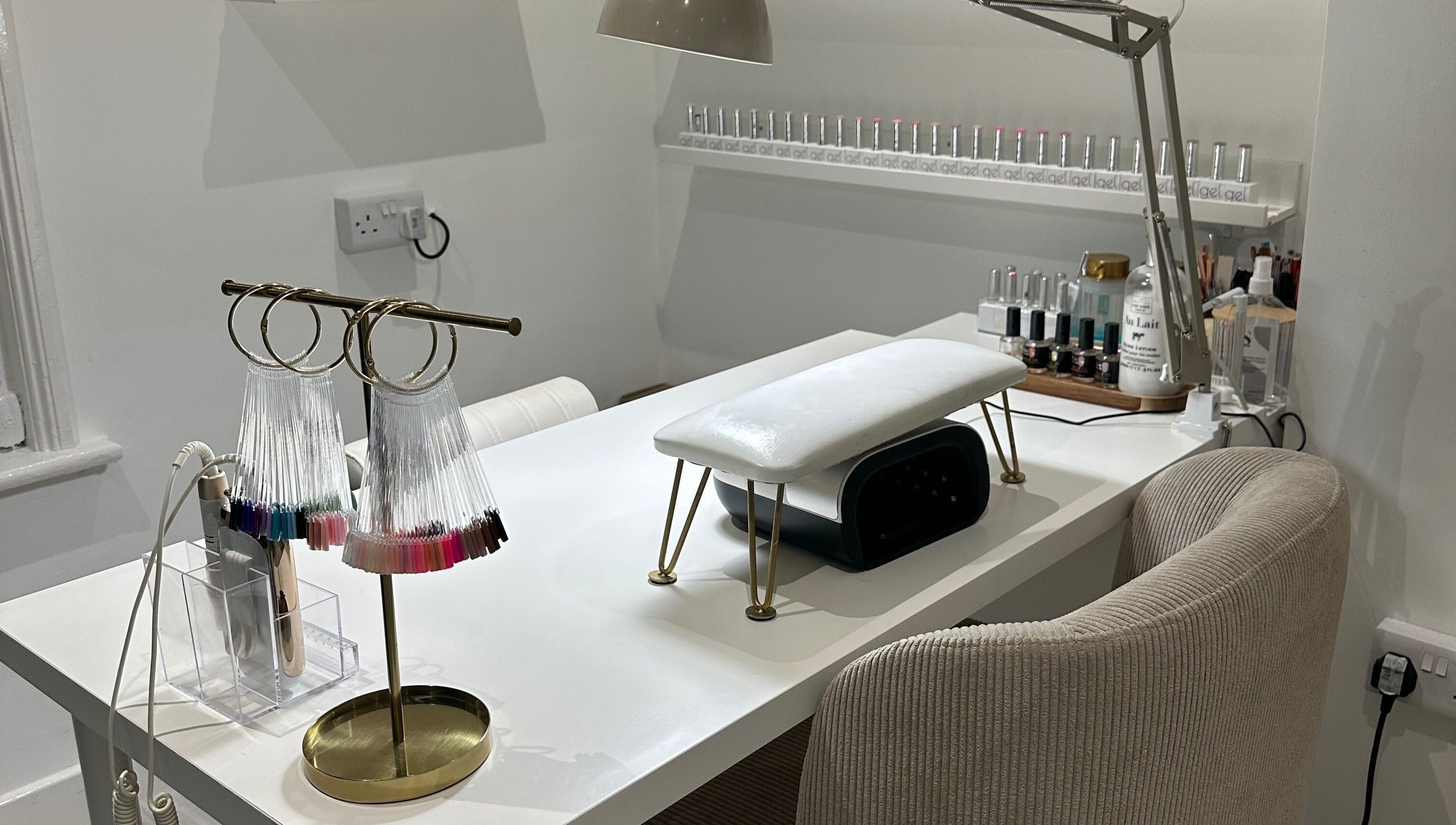 Stylish nail station at Gloss by PTB in Totton, England, GB, featuring modern decor and manicure tools.