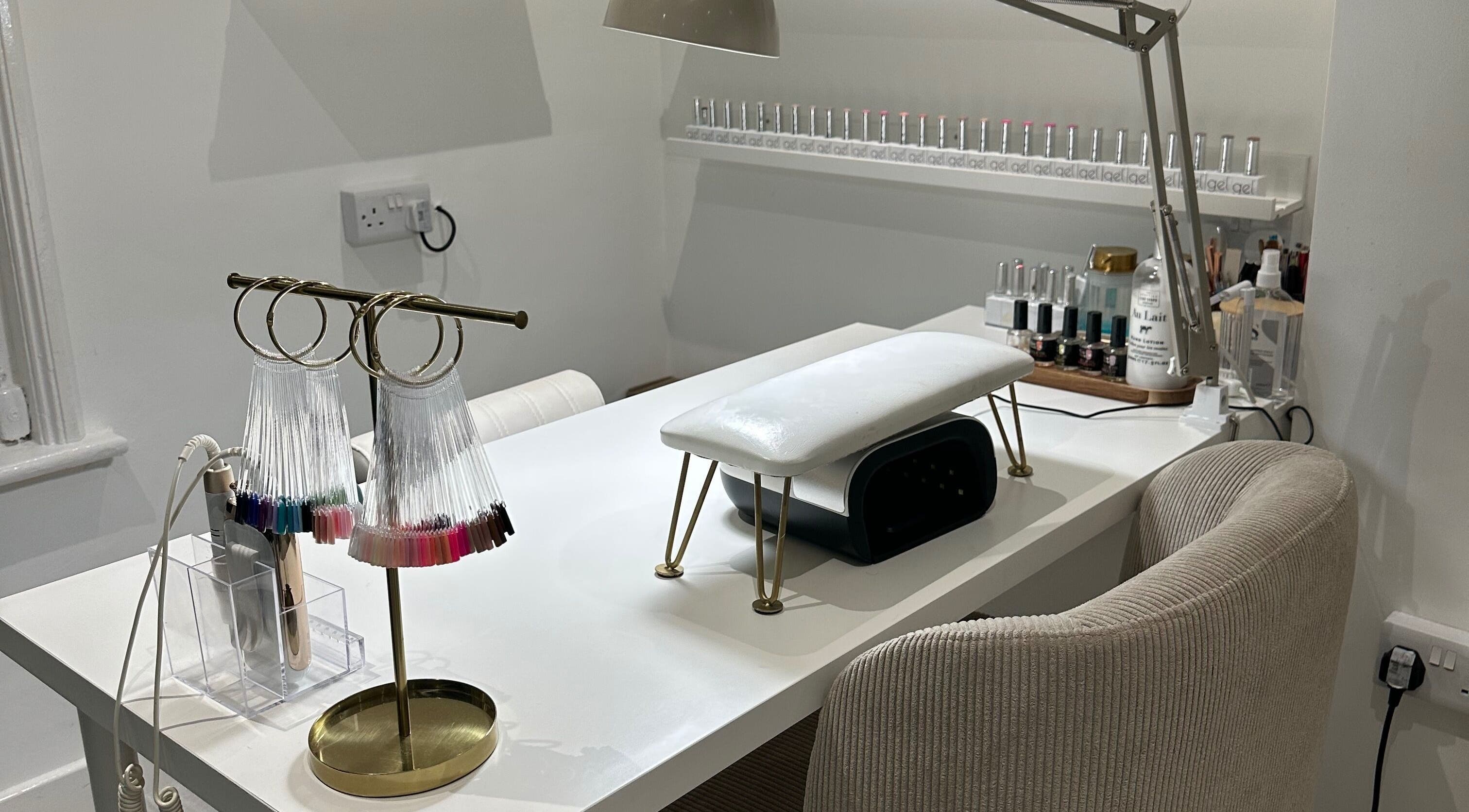 Stylish nail station at Gloss by PTB in Totton, England, GB, featuring modern decor and manicure tools.