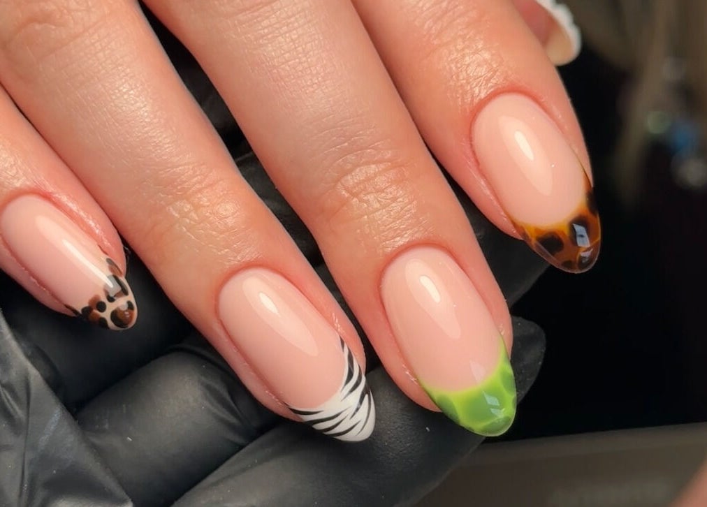 Elegant nail art at Gloss by PTB, Totton, England, GB with leopard and zebra patterns.