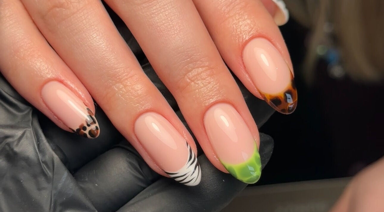 Elegant nail art at Gloss by PTB, Totton, England, GB with leopard and zebra patterns.