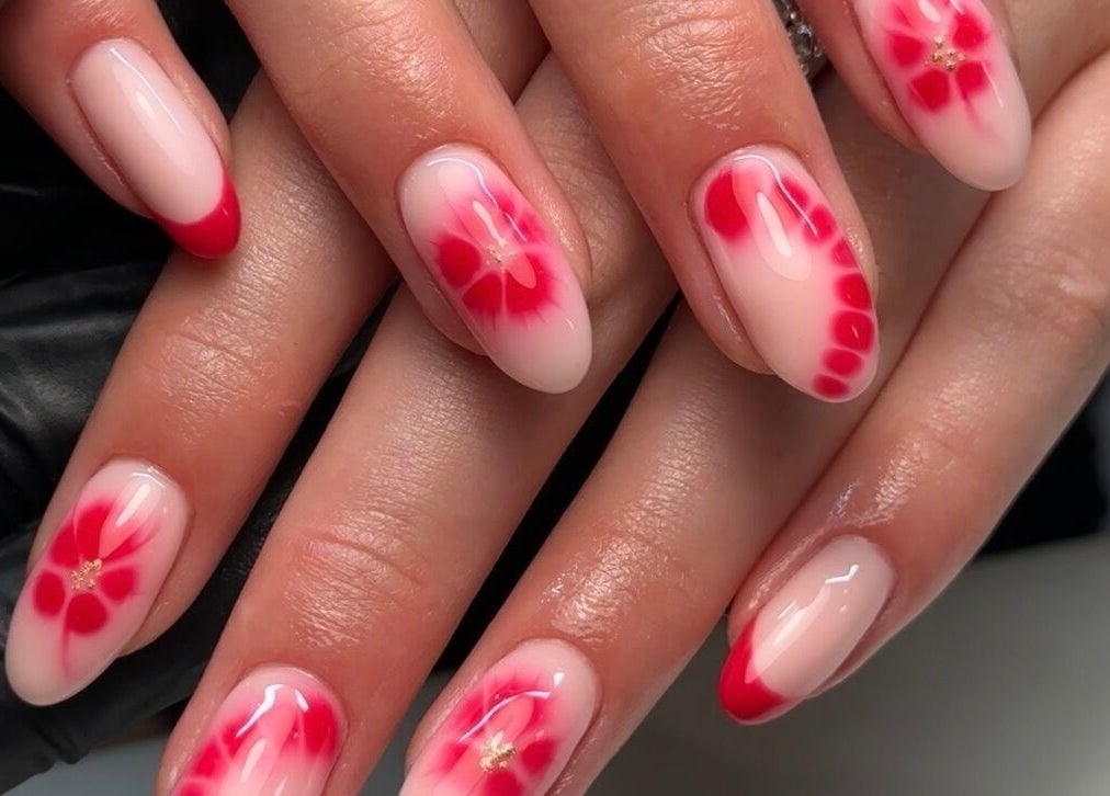 Elegant floral nail art in red at Gloss by PTB, Totton, England, GB. Perfectly crafted designs enhance beauty.