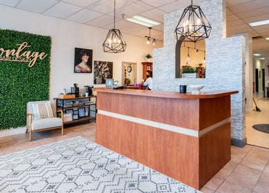 Reception area of Montage Hair Design in Williamsville, New York, US featuring modern decor and seating.