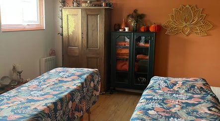 Tranquil therapy room at Jinja in Devizes, England, GB with floral decor and soothing ambiance.