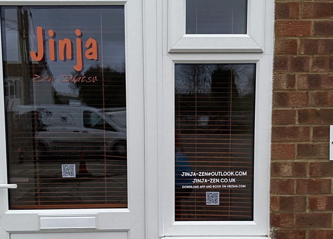 Front entrance of Jinja at Devizes, England, GB with visible signage and contact details.