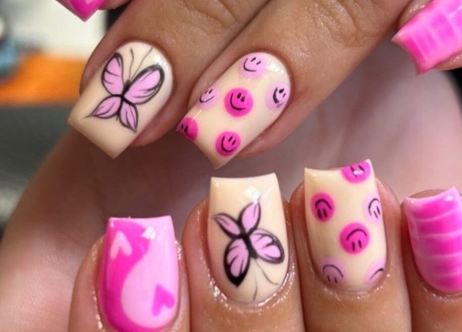 Intricate pink and butterfly nail art by Infinite by Charlie Millard in Polesworth, England, GB.
