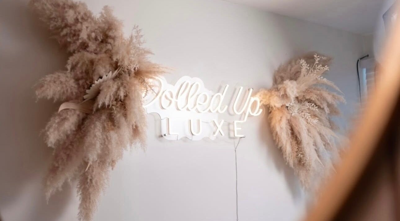 Stylish Dolled Up Beauty neon sign with pampas grass decor in Sunderland, England, GB.