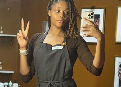 Staff member at The SQN Clinic in Houston, Texas, US, gives a peace sign in a mirror selfie.