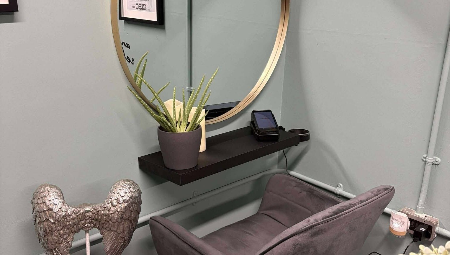 Relaxing corner with aloe plant and angel decor at Holistic Health NI, Carrickfergus, Northern Ireland, GB.