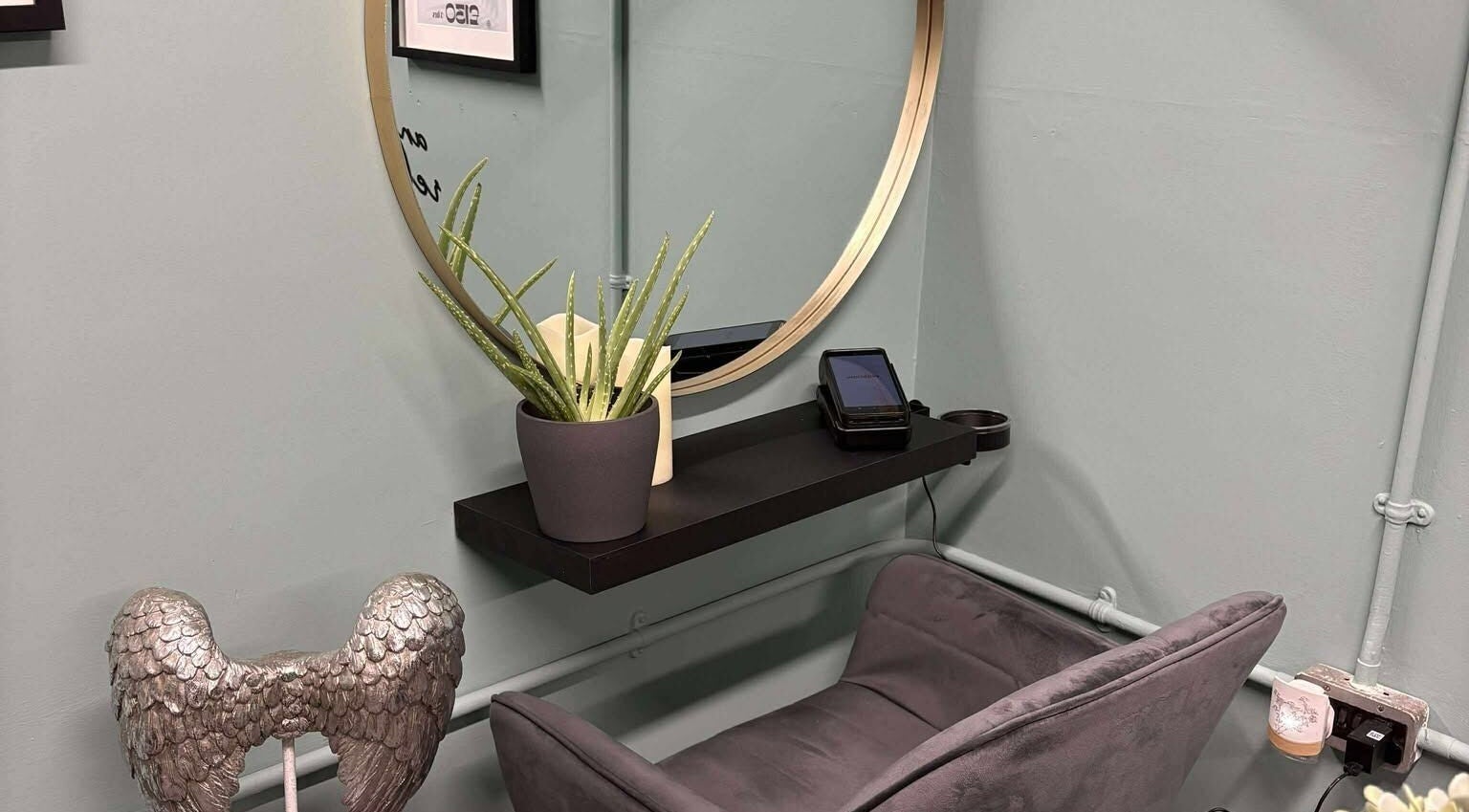 Relaxing corner with aloe plant and angel decor at Holistic Health NI, Carrickfergus, Northern Ireland, GB.