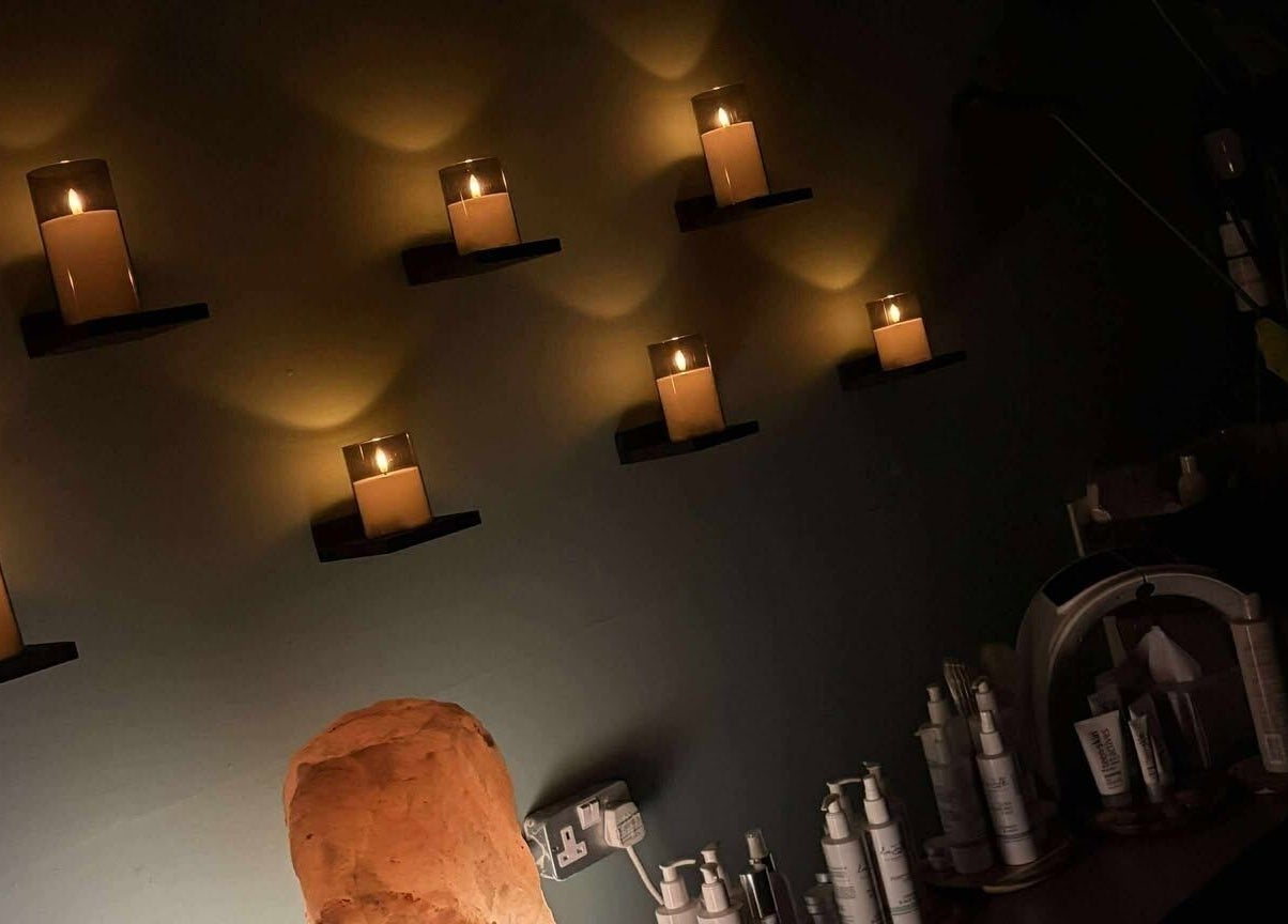 A cozy candlelit treatment room at Holistic Health NI, Carrickfergus, Northern Ireland, GB.