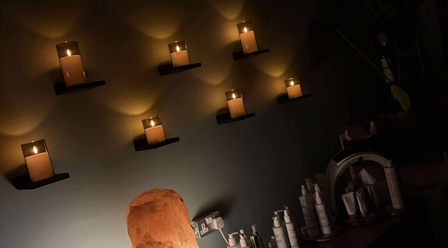 A cozy candlelit treatment room at Holistic Health NI, Carrickfergus, Northern Ireland, GB.