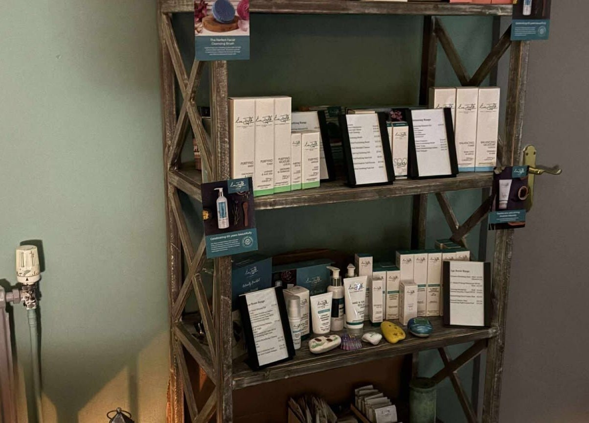 Holistic Health NI skincare product display on a rustic shelf in Carrickfergus, Northern Ireland, GB.