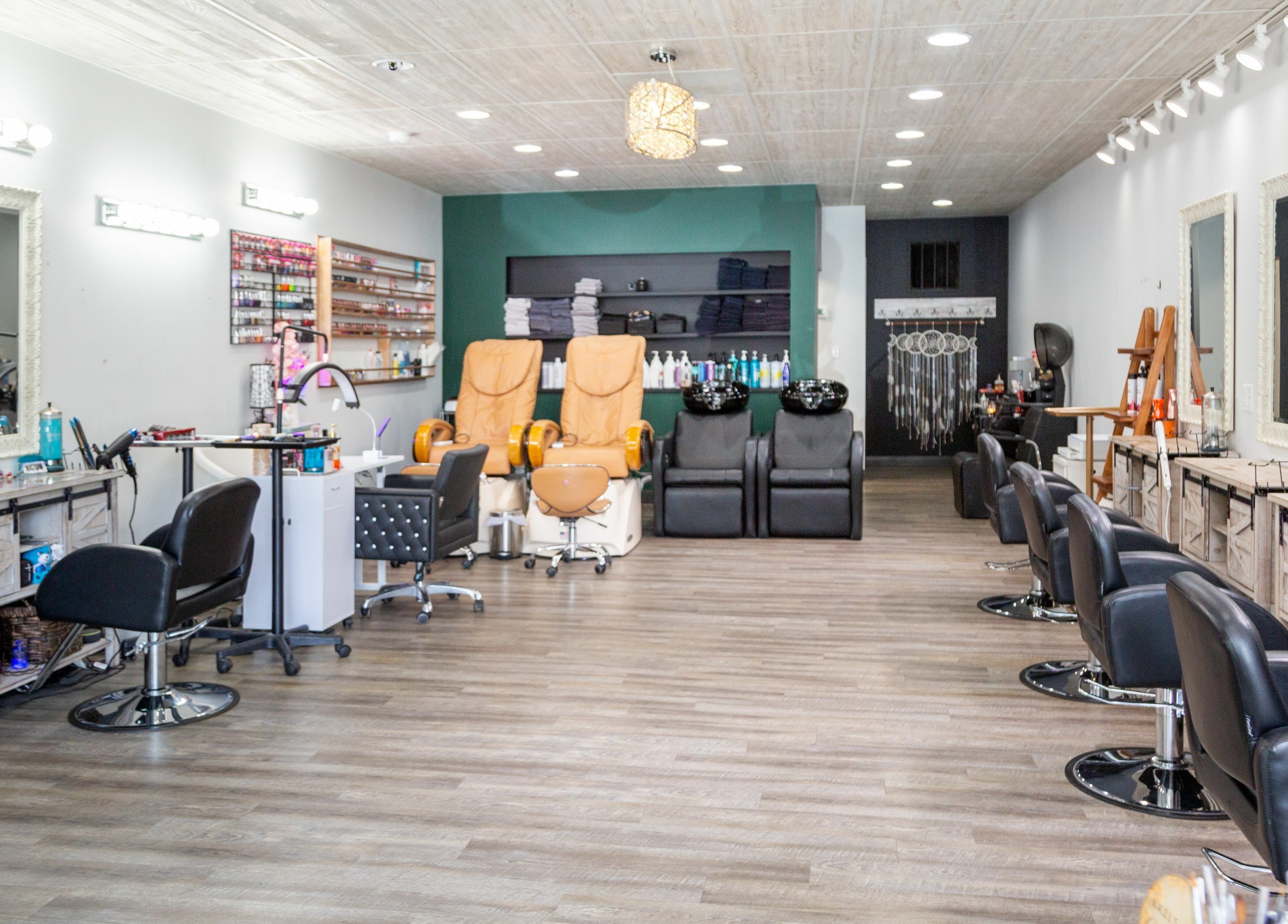 Interior of Artistic Mindz salon in Highland, Indiana, US featuring styling stations and pedicure chairs.