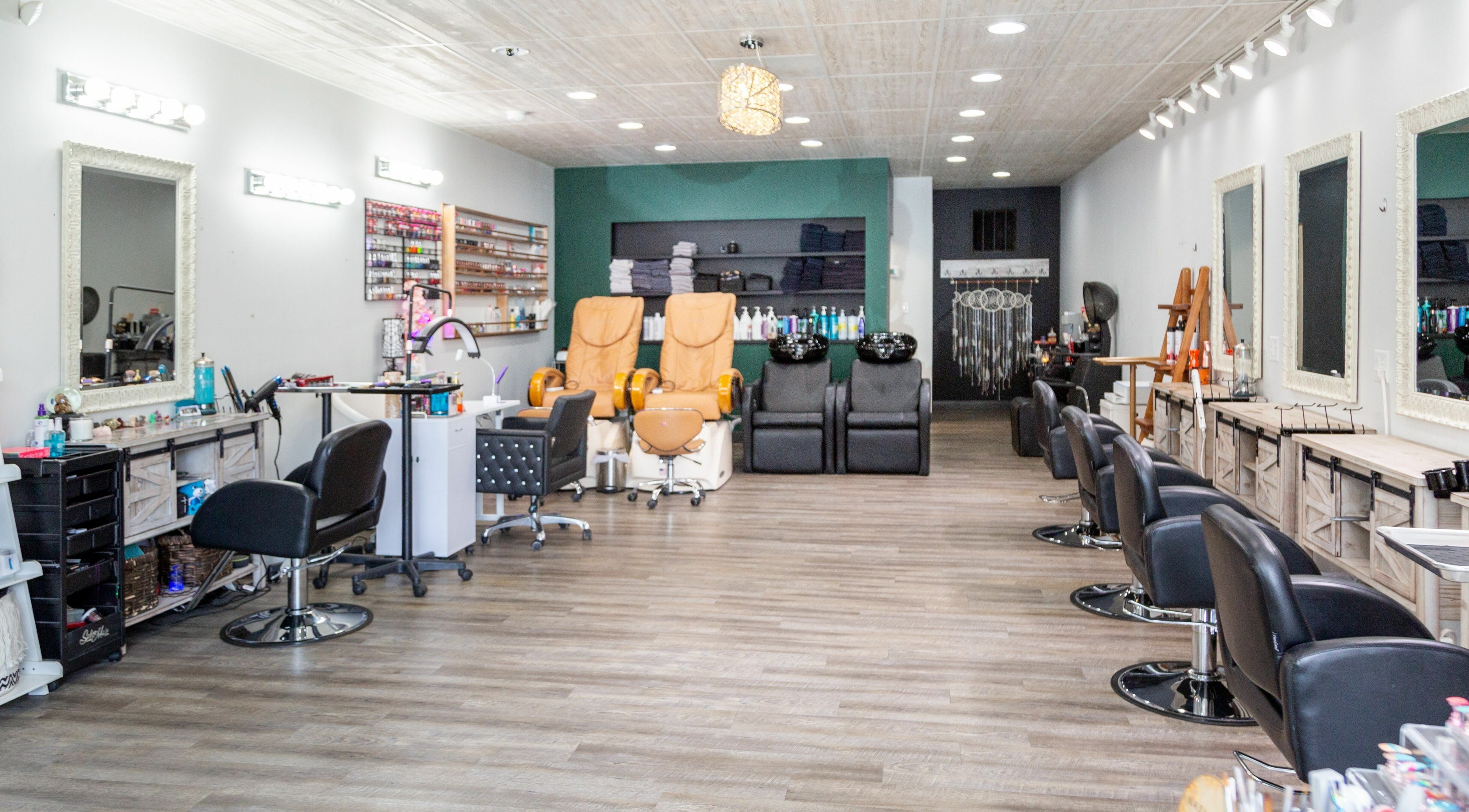 Interior of Artistic Mindz salon in Highland, Indiana, US featuring styling stations and pedicure chairs.