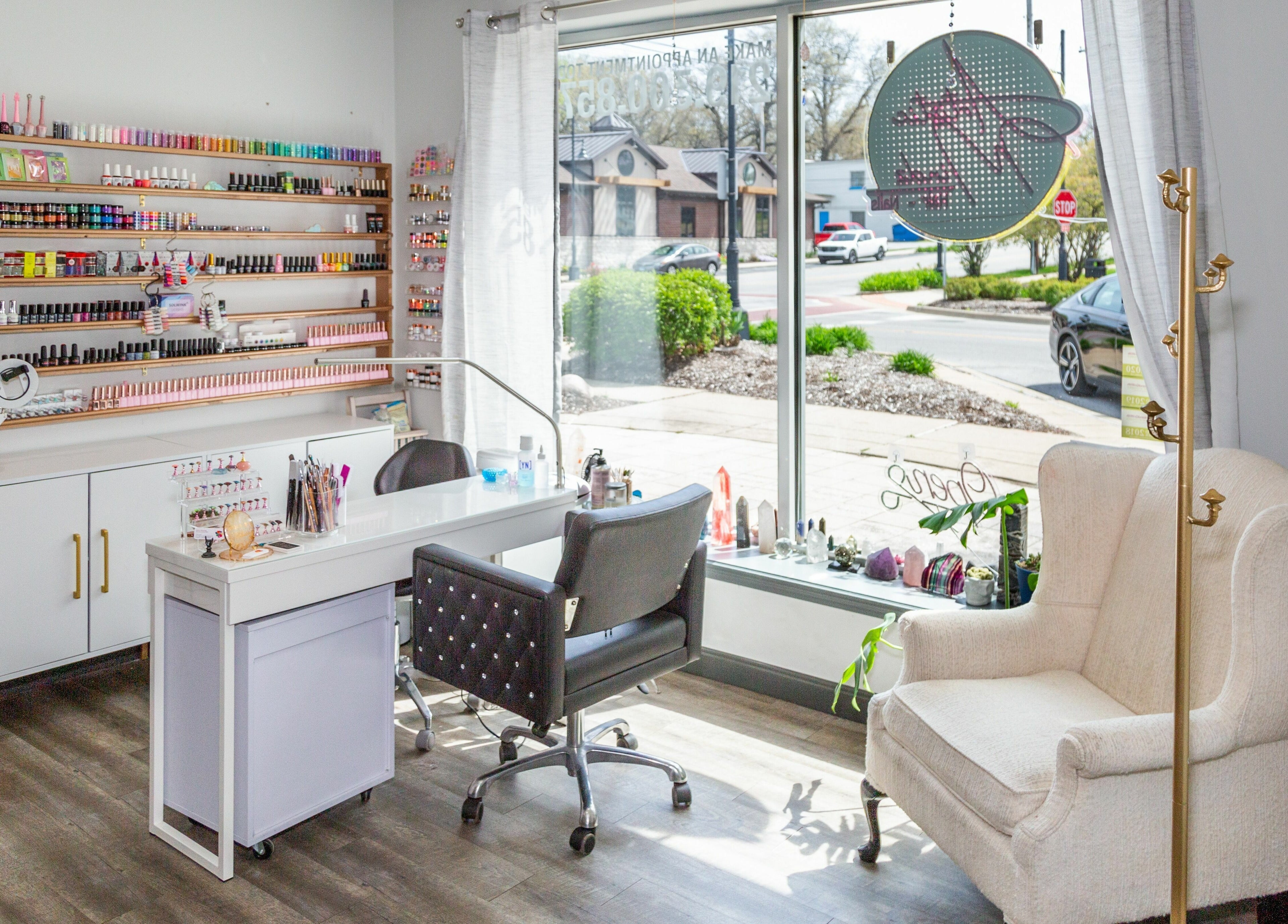 Nail salon interior at Artistic Mindz, Highland, Indiana, US with a comfortable chair and manicure station.