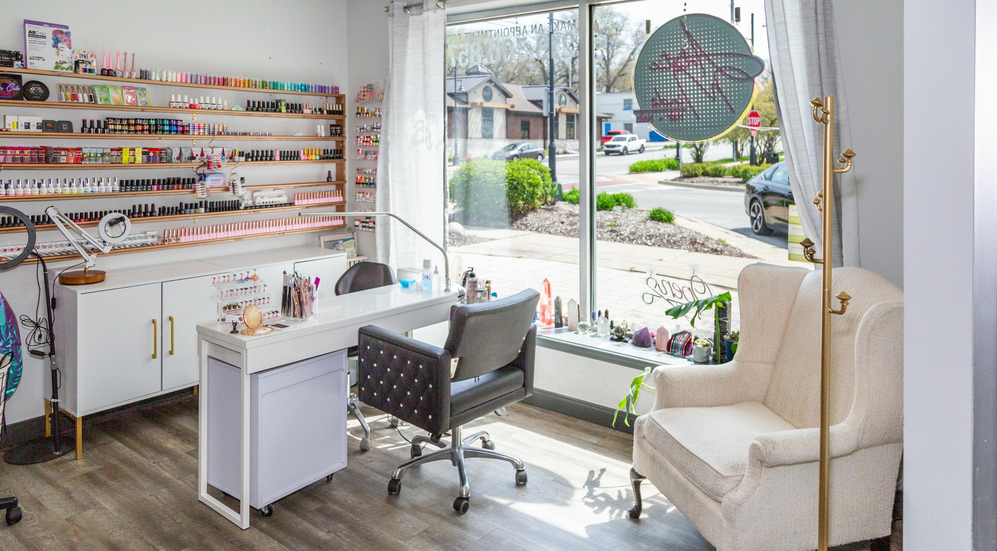 Nail salon interior at Artistic Mindz, Highland, Indiana, US with a comfortable chair and manicure station.