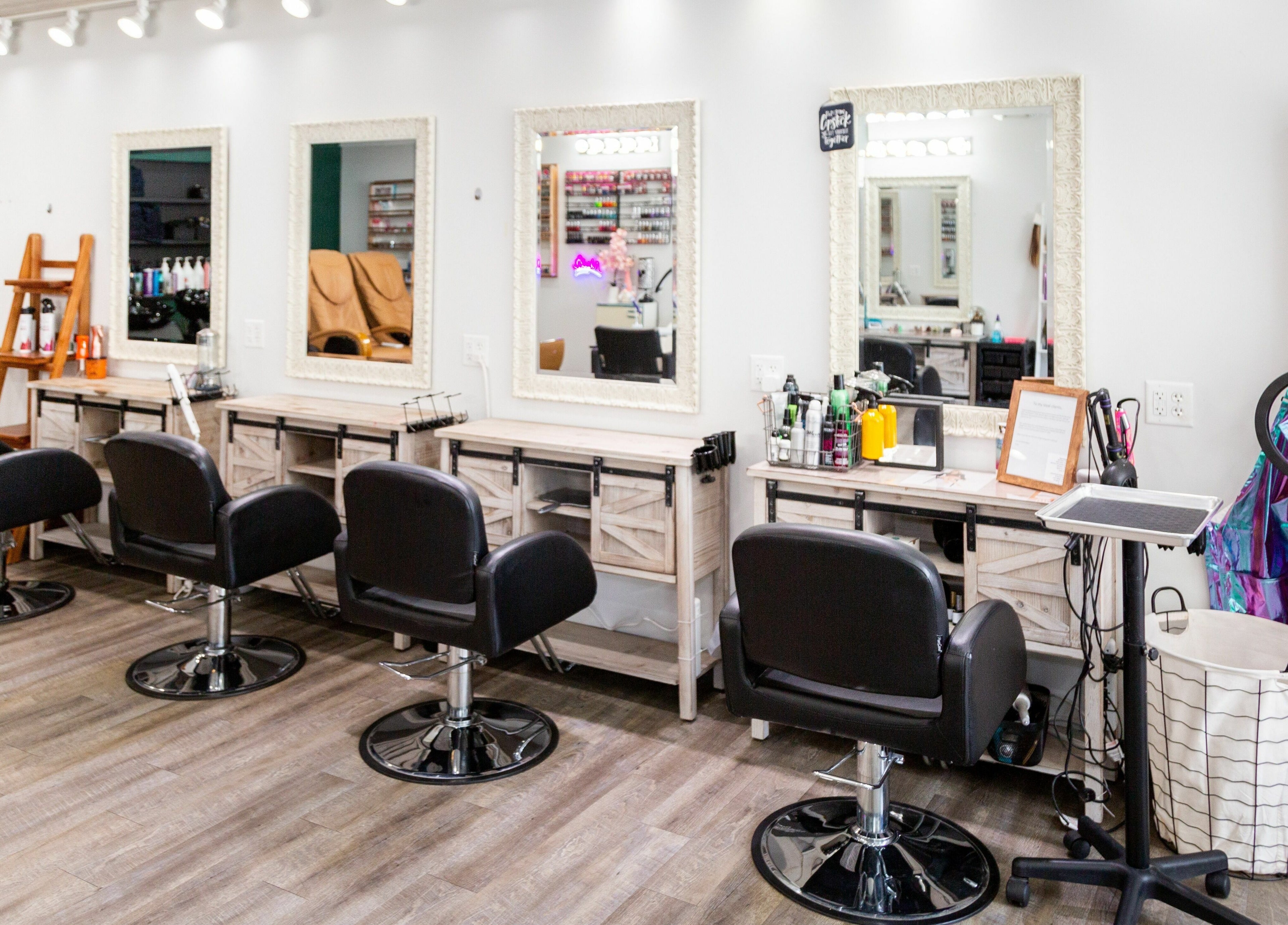 Modern salon chairs and mirrors at Artistic Mindz in Highland, Indiana, US, showcasing stylish beauty services.