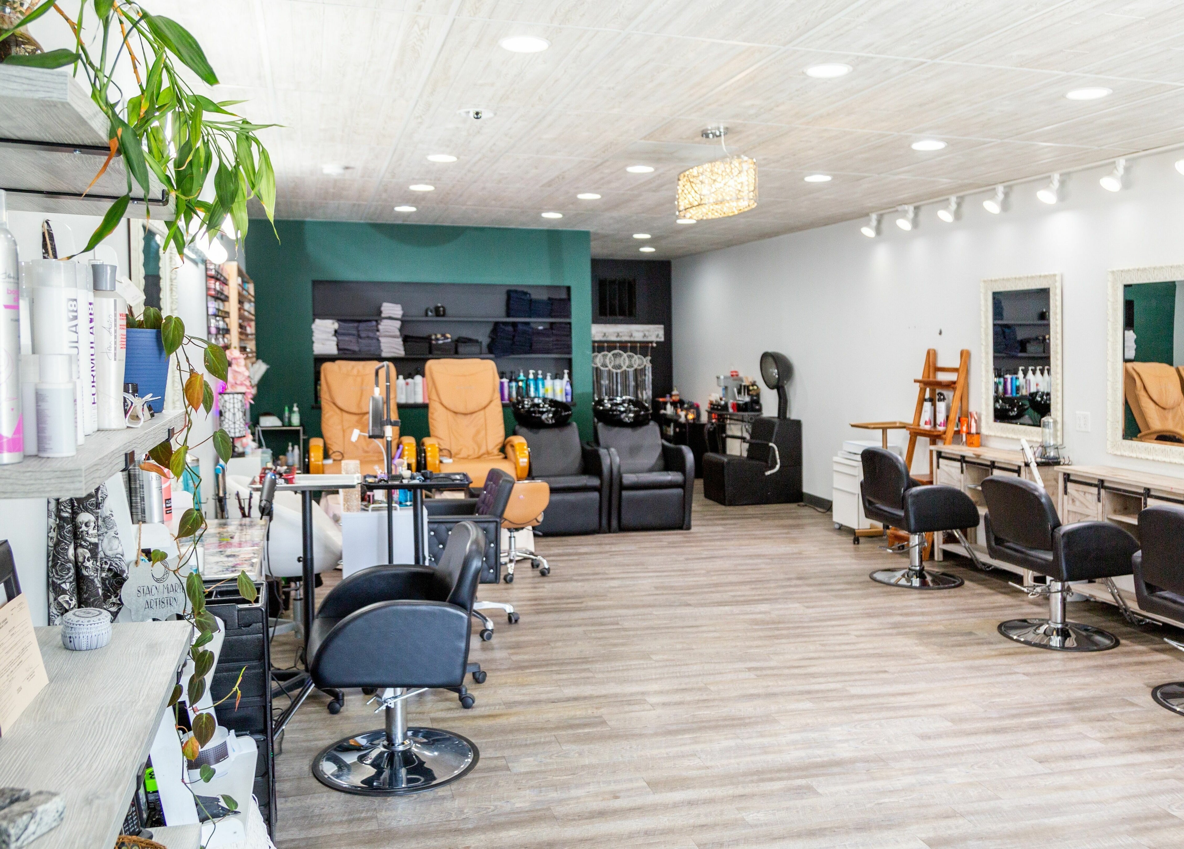 Modern salon interior at Artistic Mindz, Highland, Indiana, US featuring stylish chairs and beauty products.