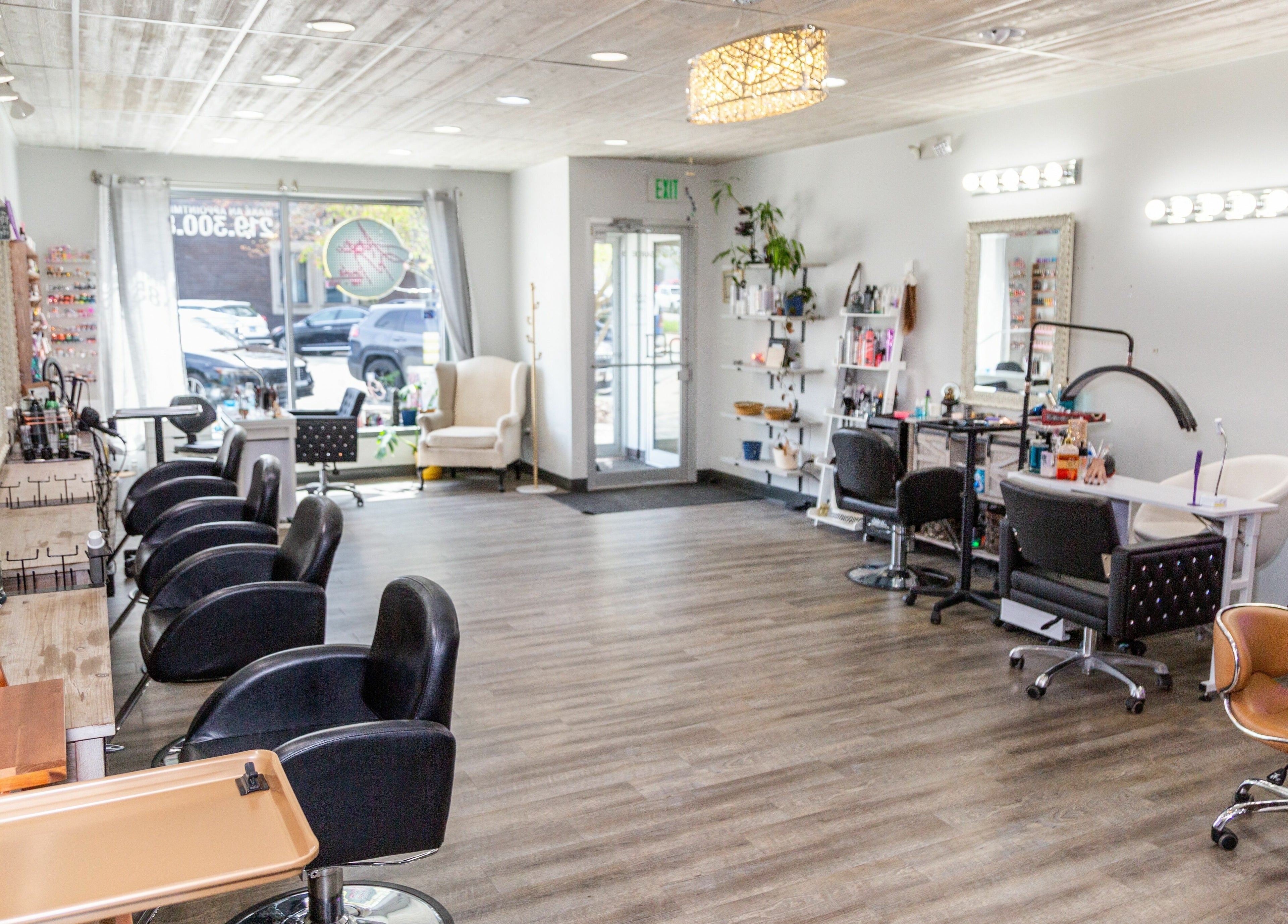 Spacious, modern salon interior at Artistic Mindz in Highland, Indiana, US, featuring stylish workstations and seating.