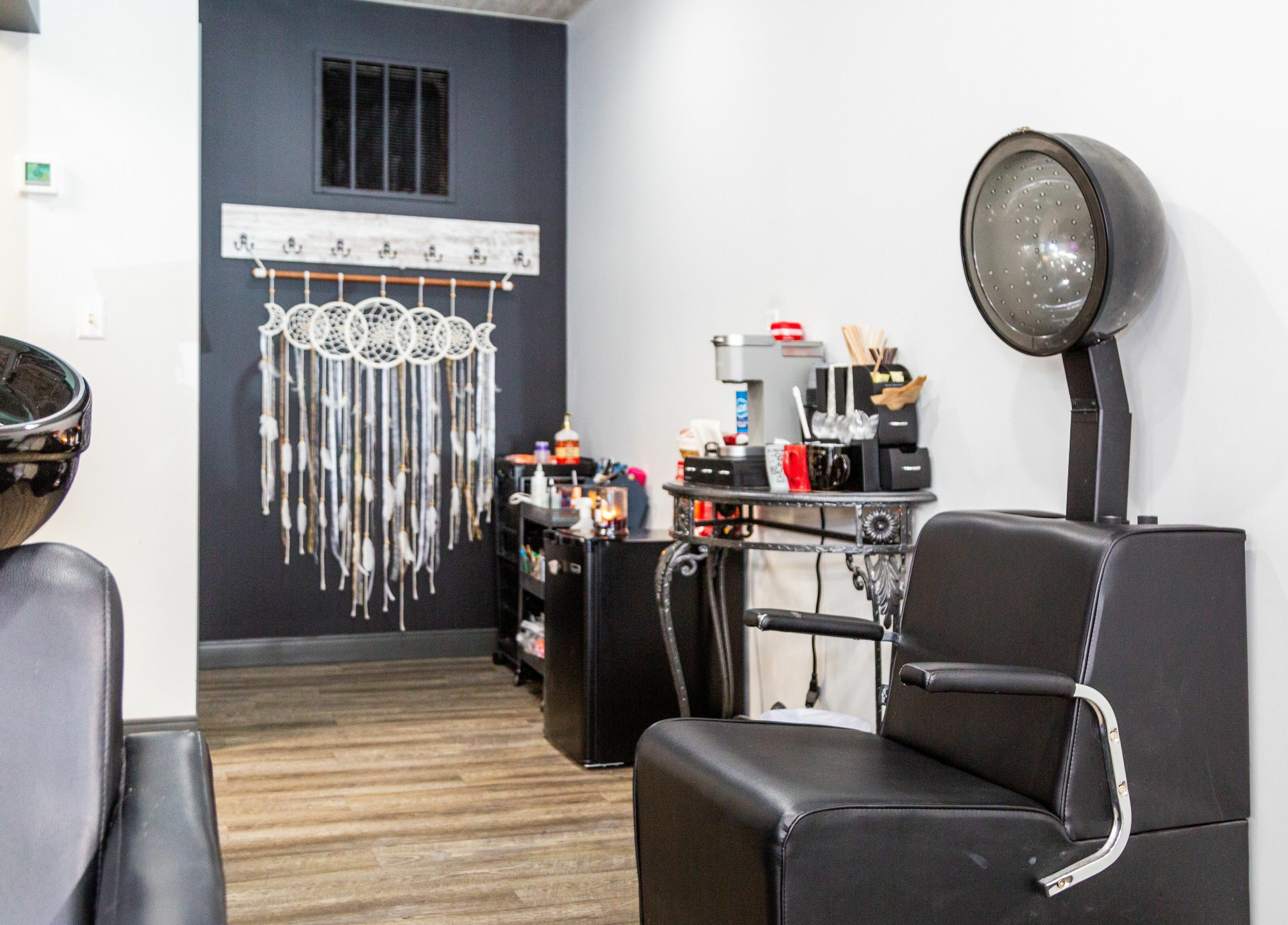 Artistic Mindz beauty station featuring sleek chairs and decor in Highland, Indiana, US.