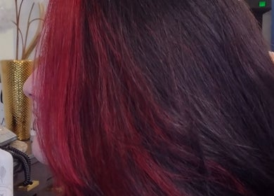 Vibrant red hair styled by Chaughn at Allure Salon Suites, Hot Springs, Arkansas, US.